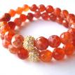 Faceted fire agate with yellow gold-plated pave crystal